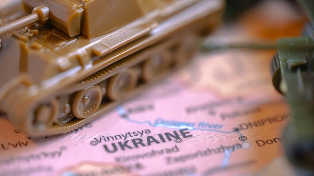 Calgary, Alberta, Canada. Mar 28, 2022. Macro Top view of Scale Model Tanks War Panther Tanks on a Ukraine map. Concept: Russian invasion of Ukraine