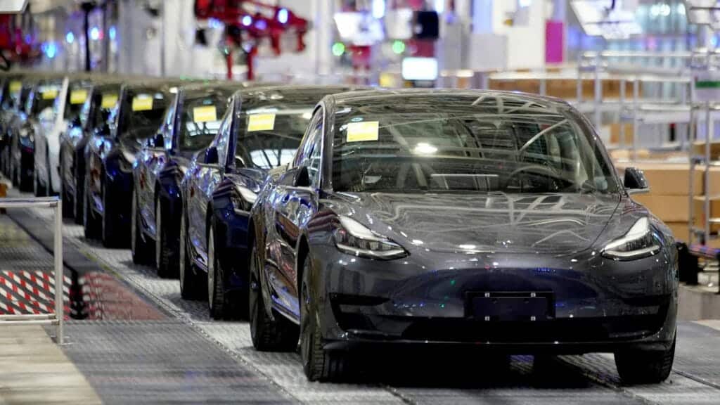 FILE PHOTO: Tesla China-made Model 3 vehicles are seen during a delivery event at its factory in Shanghai, China January 7, 2020. REUTERS/Aly Song/File Photo