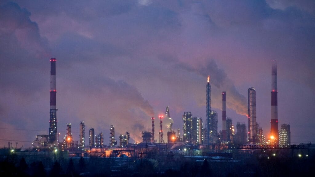 FILE PHOTO: Flue gas and steam rise out of chimneys and smokestacks of an oil refinery during sunset on a frosty day in the Siberian city of Omsk, Russia, February 8, 2023. REUTERS/Alexey Malgavko//File Photo