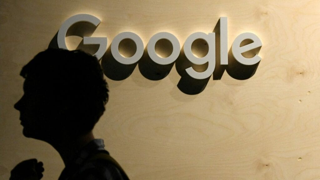 A woman passes the logo from the web search engine provider Google during the digital society festival 're:publica', at the Arena Berlin in Berlin, Germany June 9, 2022. REUTERS/Annegret Hilse//File Photo