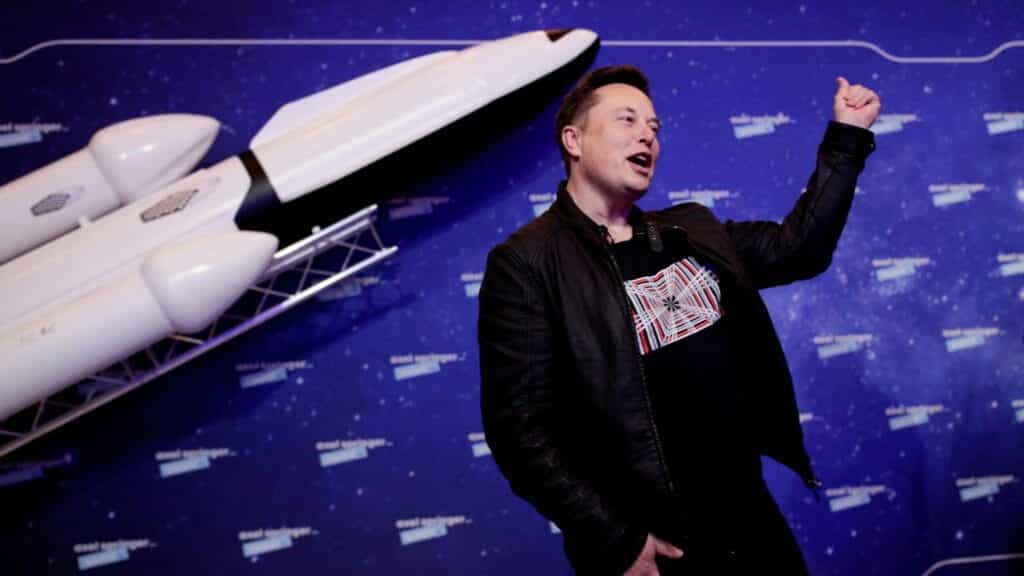 FILE PHOTO: SpaceX owner and Tesla CEO Elon Musk gestures after arriving on the red carpet for the Axel Springer award, in Berlin, Germany, December 1, 2020. REUTERS/Hannibal Hanschke/Pool/File Photo