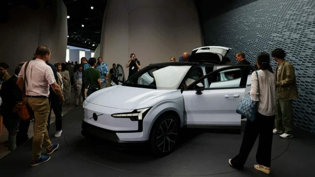 FILE PHOTO: People look on during the reveal event of the Volvo EX30 electric SUV vehicle in Milan, Italy June 7, 2023. REUTERS/Claudia Greco/File Photo