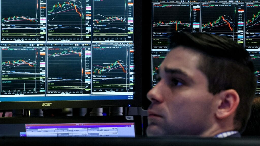 FILE PHOTO: A trader works on the floor at the New York Stock Exchange (NYSE) in New York City, U.S., October 27, 2023.  REUTERS/Brendan McDermid/File Photo