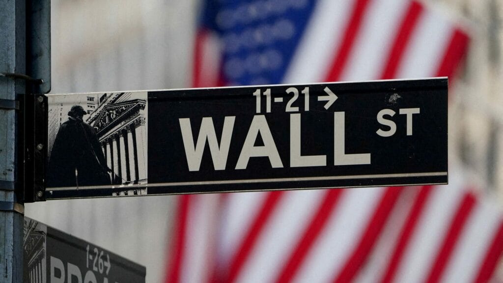 FILE PHOTO: The Wall Street sign is pictured at the New York Stock exchange (NYSE) in the Manhattan borough of New York City, New York, U.S., March 9, 2020. REUTERS/Carlo Allegri/File Photo