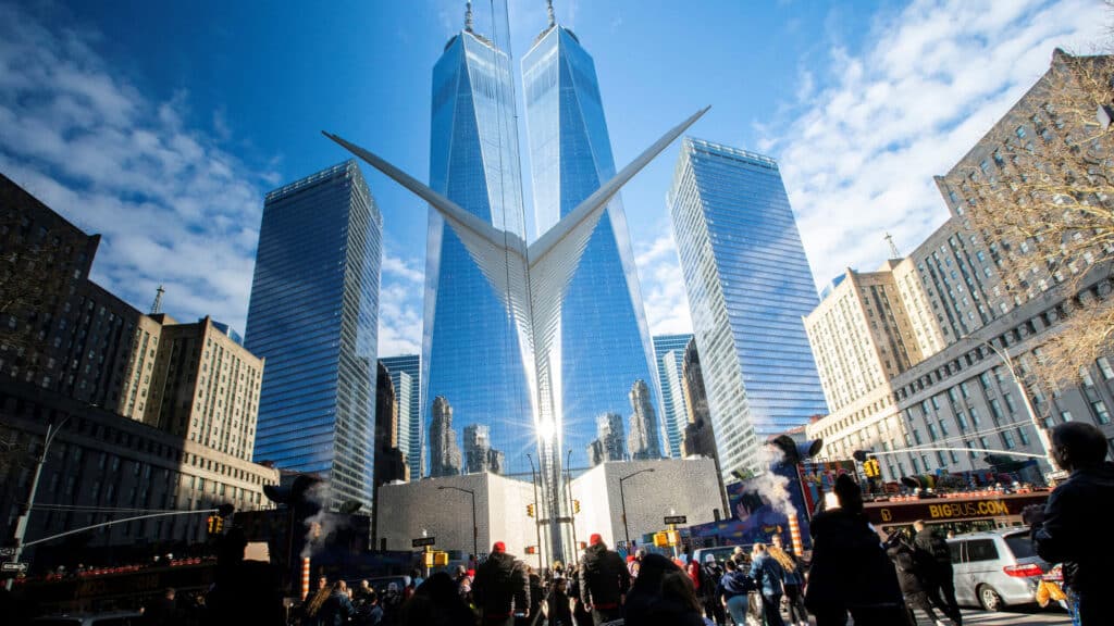 People walk around the Financial District near the New York Stock Exchange (NYSE) in New York, U.S., December 29, 2023. REUTERS/Eduardo Munoz
