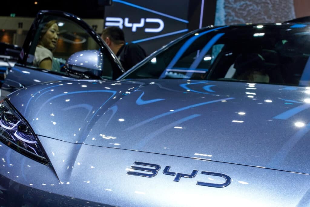 FILE PHOTO: A visitor stands next to a BYD Sealion 7 EV car at the 41st Thailand International Motor Expo, in Bangkok, Thailand, November 29, 2024. REUTERS/Athit Perawongmetha/File Photo