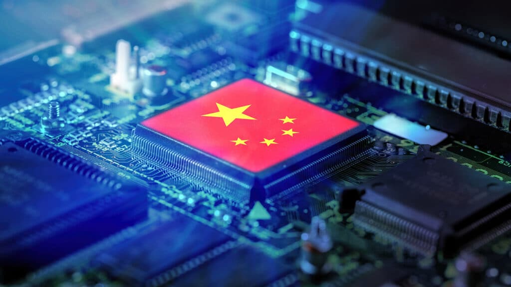 China flag on a CPU processor. Chinese Chip manufacturer concept, GPU microchip on a motherboard.