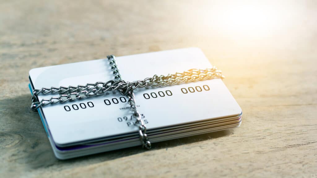 Credit card account is blocked the chain lock. It is not possible to make transactions. Data theft protection credit card security concept.