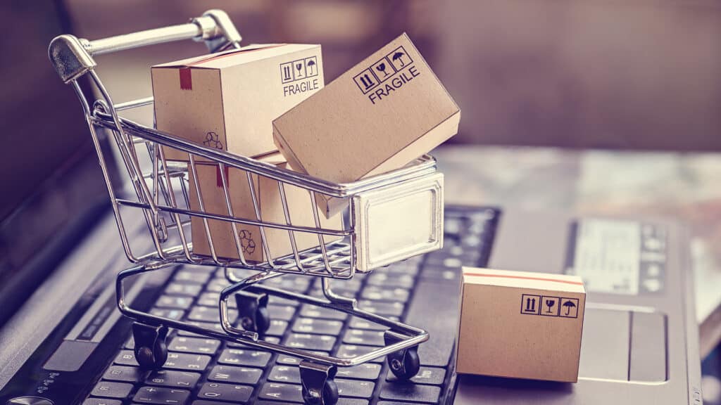 Boxes in a trolley on a laptop keyboard. Ideas about online shopping, online shopping is a form of electronic commerce that allows consumers to directly buy goods from a seller over the internet.