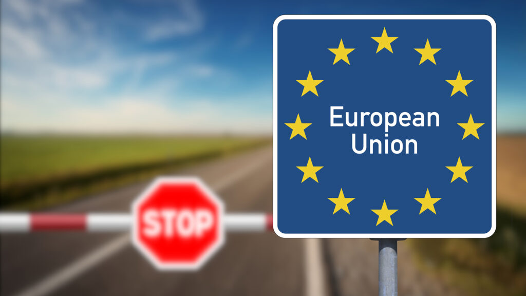 European border, sign European Union and a border post with a barrier and stop sign