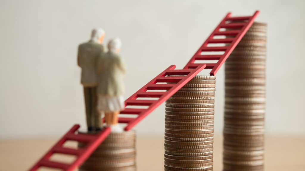 Old senior couple person walking on growth stack coins graph chart with red ladder. Financial planning for retirement, savings, pension, gain return on investment, wealth and so on concept.