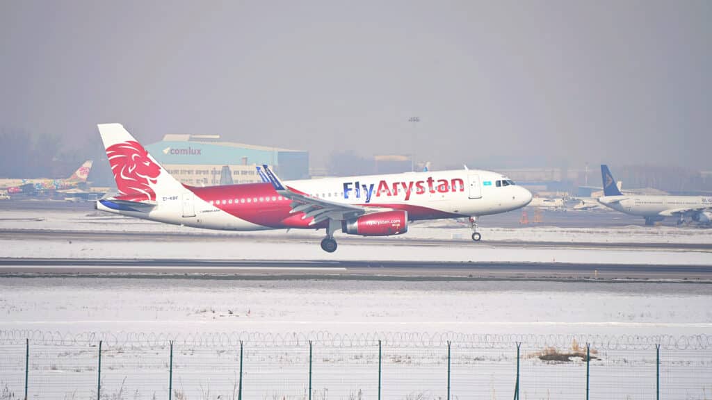Almaty, Kazakhstan - 02.10.2024 : The Fly Arystan plane lands at the airport on the runway.