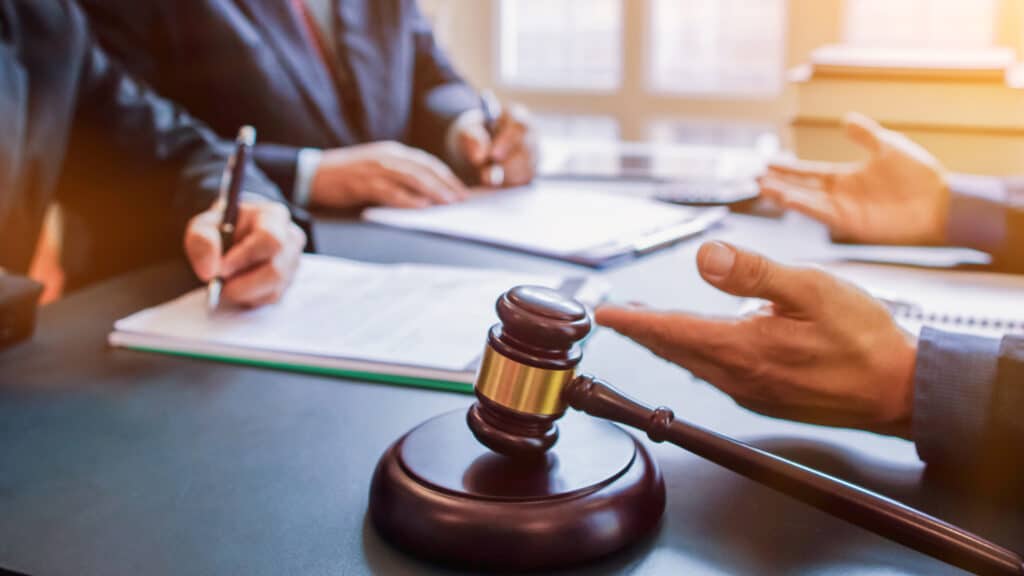 Judge gavel is placed on table in office of lawyer team It is gavel used as symbol of making decision in court case with fairness and ethics. judge gavel is prepared symbolize decision in court case.