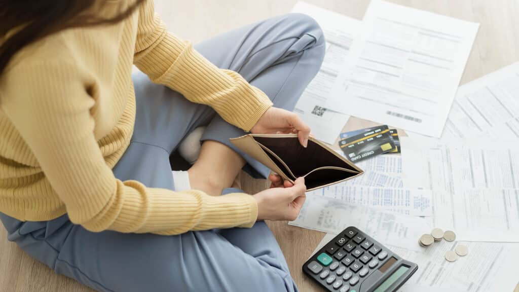 Stressed, Problem business person woman holding and open empty wallet, purse no have money for bill payment, credit card loan or expense. Bankruptcy, bankrupt or debt financial, mortgage concept.