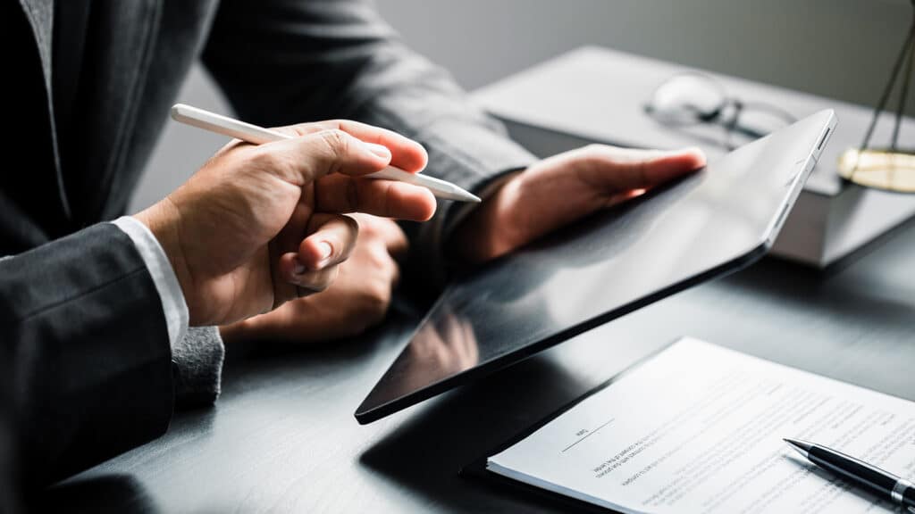 Close up of businessman or lawyers discussing about contract or  business agreement at law firm office, business people making deal document legal, law and justice advice service concept.