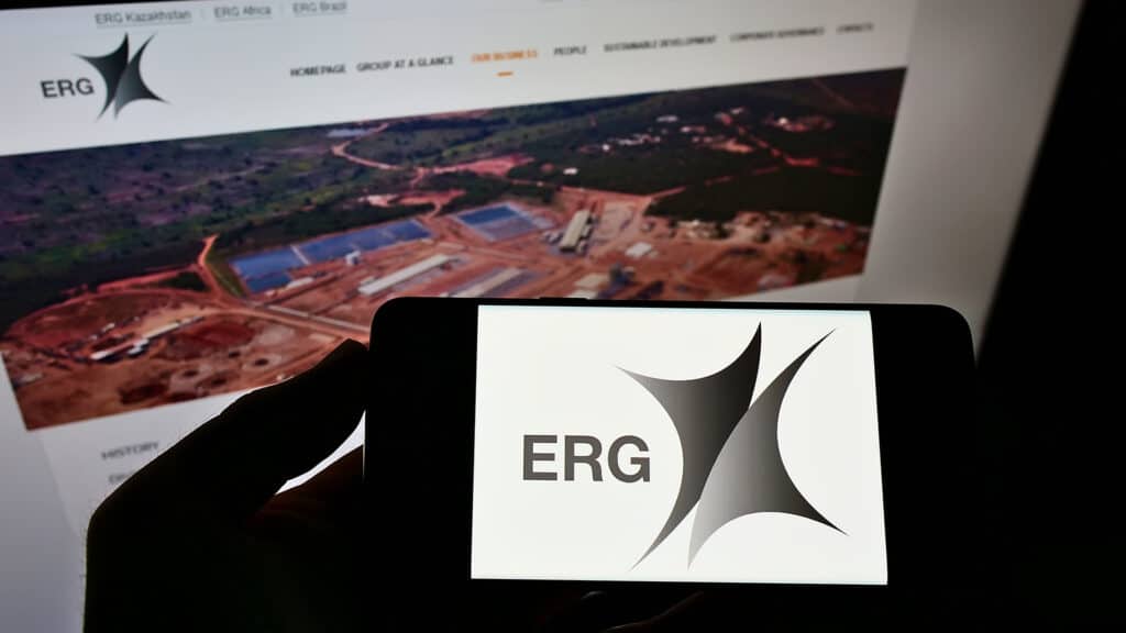 Stuttgart, Germany - 06-06-2021: Person holding cellphone with logo of mining company Eurasian Resources Group (ERG) S.à r.l. on screen in front of web page. Focus on phone display. Unmodified photo.