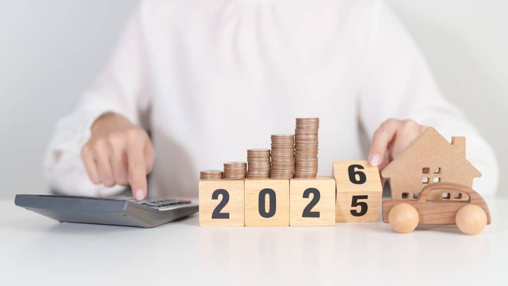 2025 end year to Happy New Year 2026 with car and Home model with coin stack. Car loan, Interest rate, real estate, house, Insurance, Financial, Repair, Tax, mortgage and Maintenance