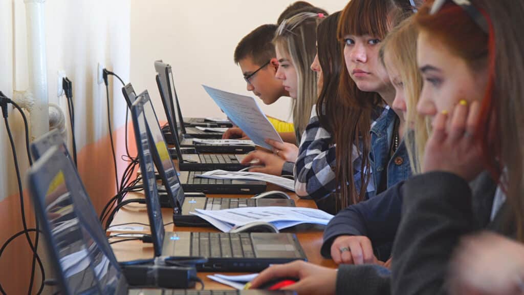 Chapaevsk, Samara region, Russia - April 17, 2019: College in Chapaevsk city. Students in a computer class. Students in front of computers in a computer class. Soft focus