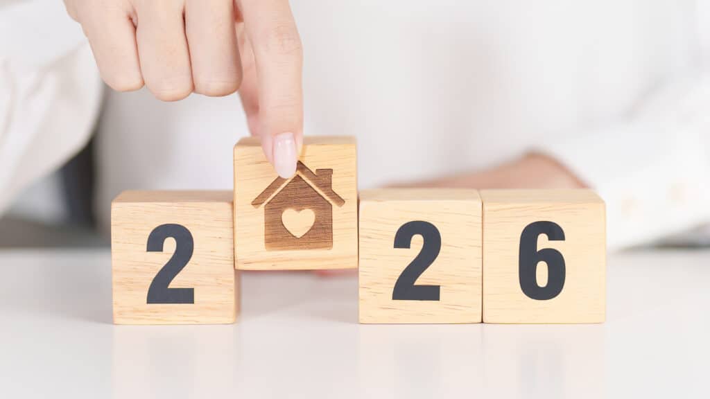 2026 with Home and Heart block. Property investment, House Mortgage, Real Estate tax, homeless, donation, Financial and happy family concepts