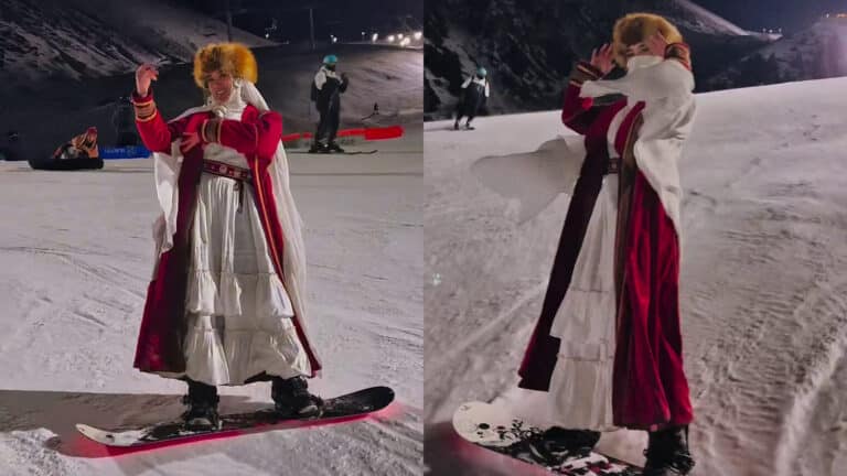 Девушка в традиционном казахском платье прокатилась на сноуборде на Шымбулаке