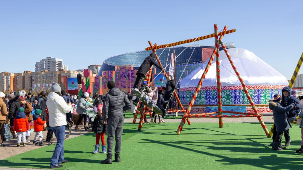 Astana, Kazakhstan - March 21, 2023: Swings, yurts, holiday stages were installed on Astana's Independence Square to celebrate Nauryz (Nauryz means "new day") holiday. Celebration of Nauryz begins wit