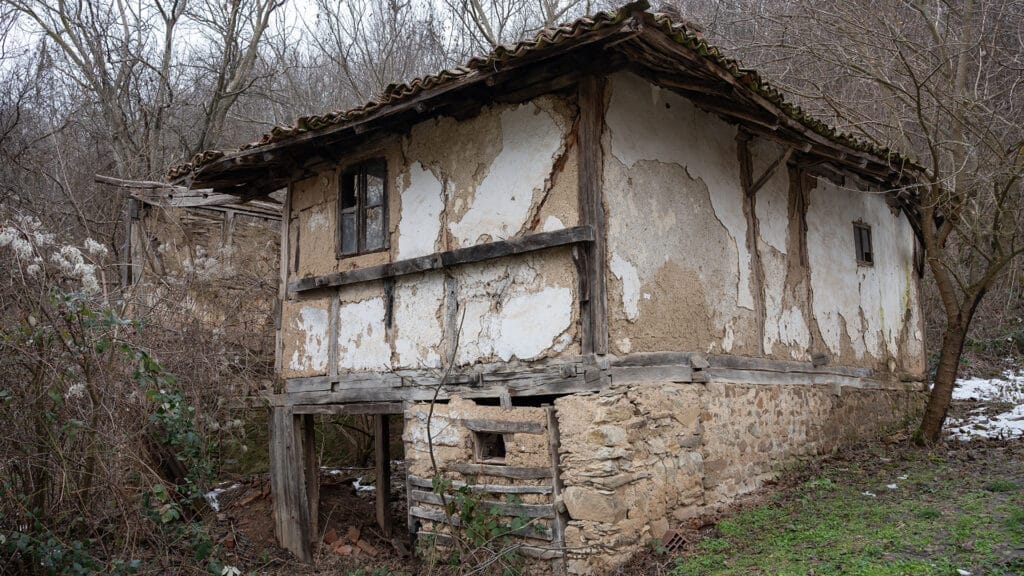 Old abandoned rural house made of mud and wood in Eastern Europe