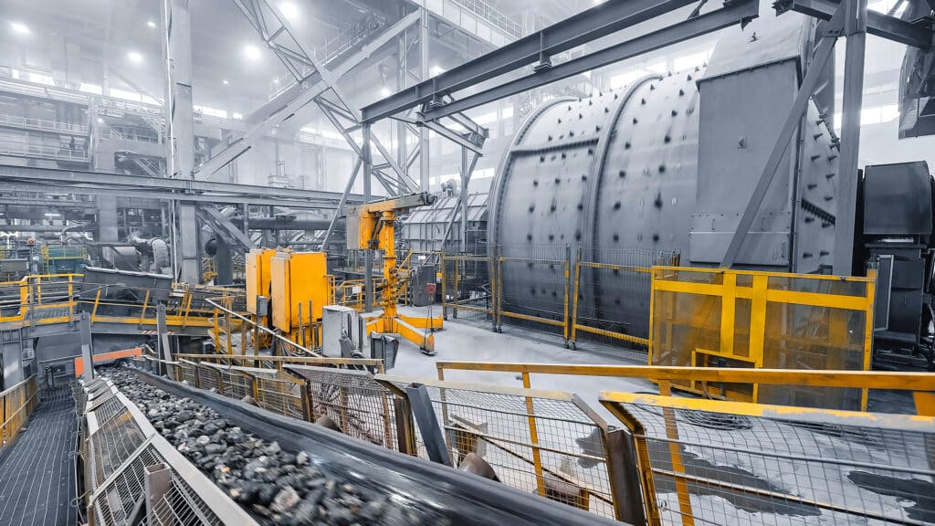 Grinding ball mill operates with mineral ore at plant for copper and gold concentrate. Industry Concentration factory.