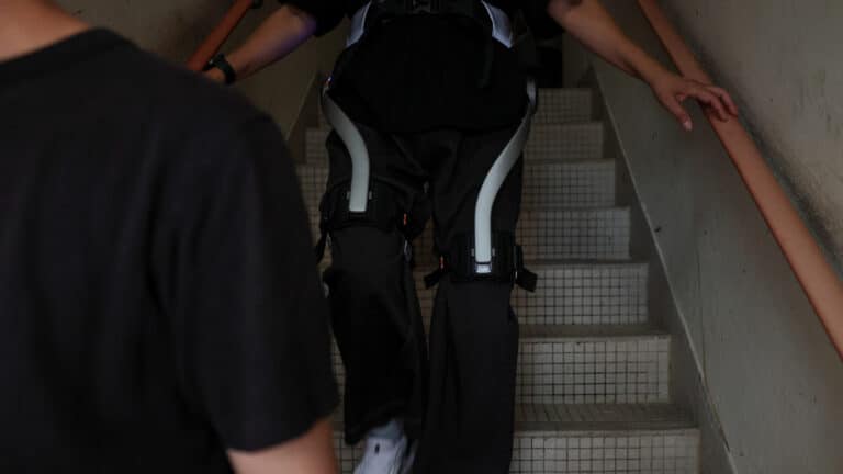 Elderly fire survivors in Hong Kong use robotic legs to retrieve belongings