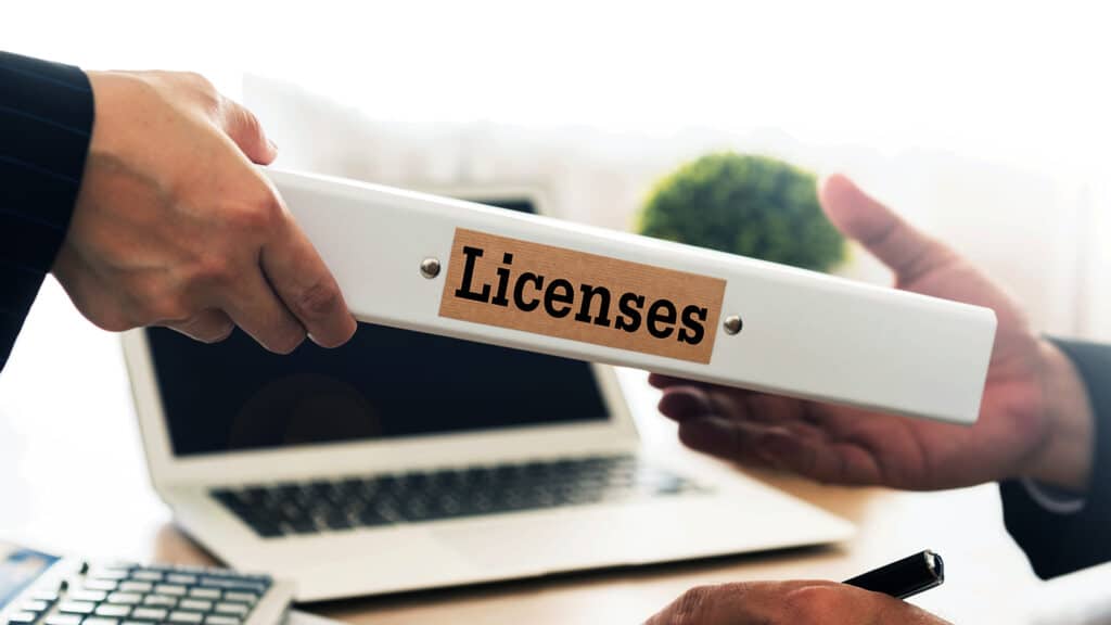 Licenses Concept. Staff send licenses folder to business people.
