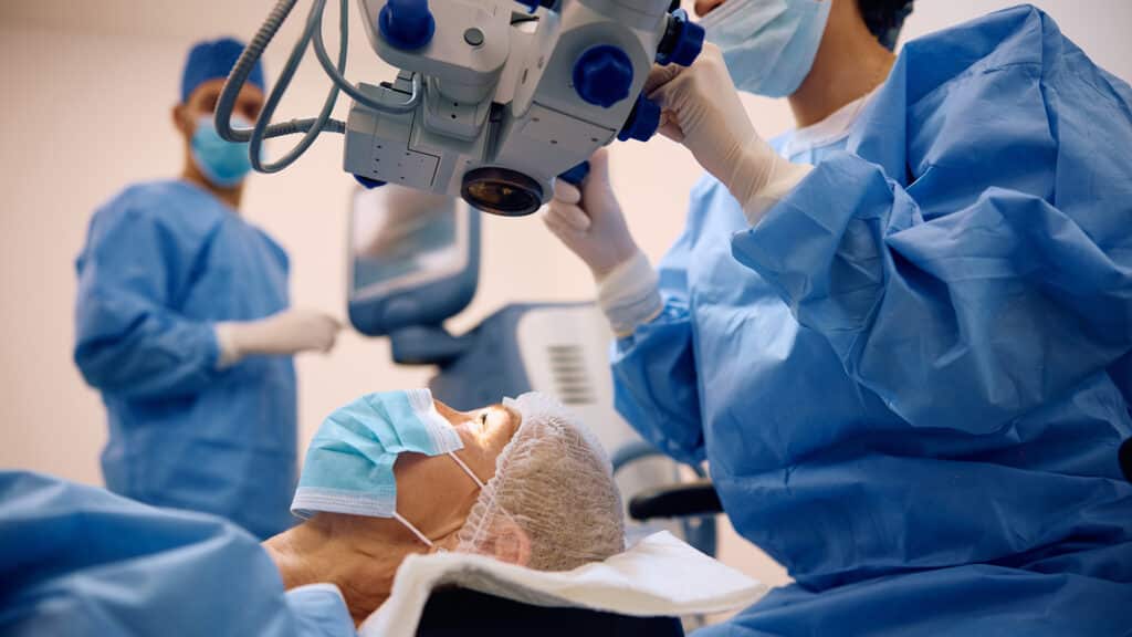 Mature woman having eye surgery at ophthalmology clinic.