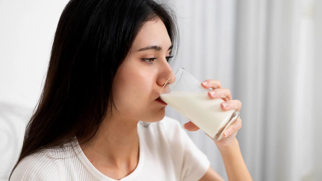 A young woman who likes to drink milk every morning.