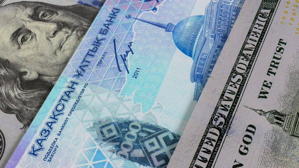 Banknotes of Kazakhstani tenge and US dollar. Cash. Financial concept.